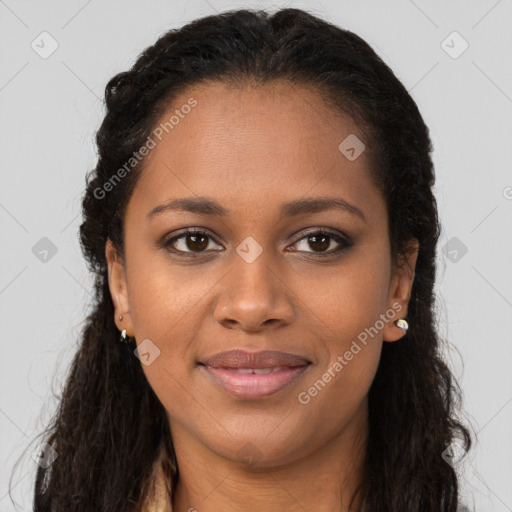 Joyful black young-adult female with long  brown hair and brown eyes