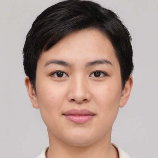 Joyful asian young-adult female with short  black hair and brown eyes
