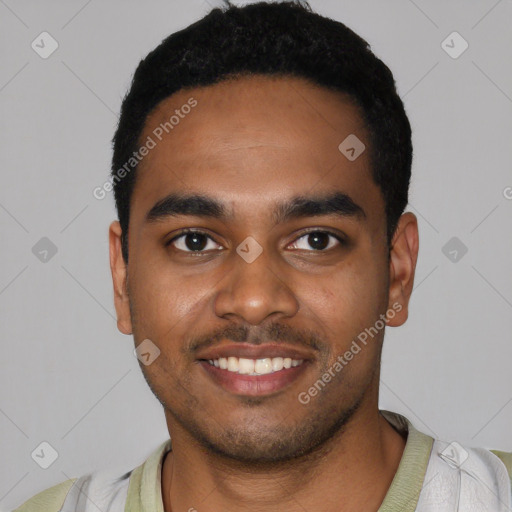 Joyful black young-adult male with short  black hair and brown eyes