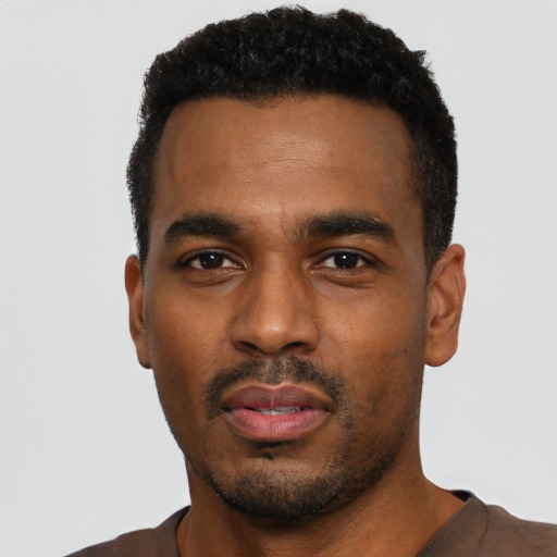 Neutral black young-adult male with short  black hair and brown eyes