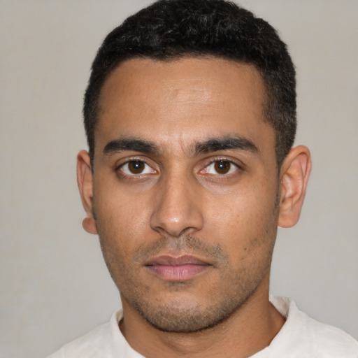 Neutral latino young-adult male with short  black hair and brown eyes
