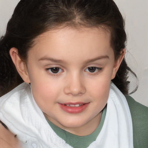 Joyful white child female with short  brown hair and brown eyes