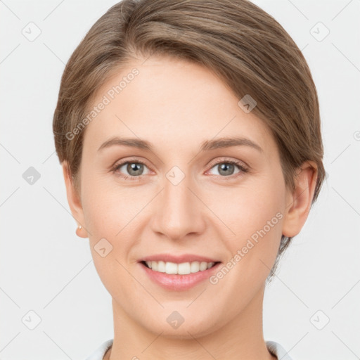 Joyful white young-adult female with short  brown hair and grey eyes