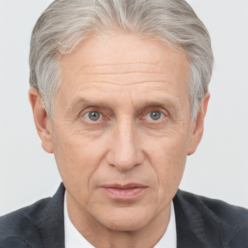 Joyful white middle-aged male with short  gray hair and brown eyes