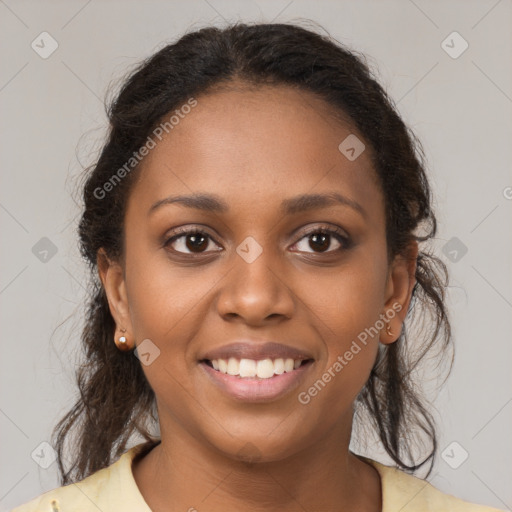 Joyful black young-adult female with medium  brown hair and brown eyes