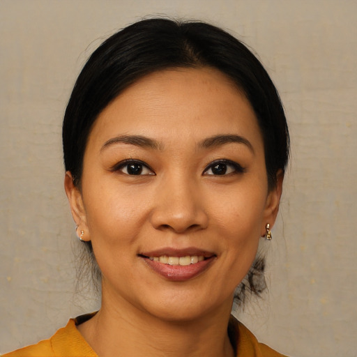 Joyful asian young-adult female with short  black hair and brown eyes