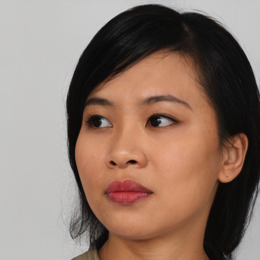 Neutral asian young-adult female with medium  black hair and brown eyes