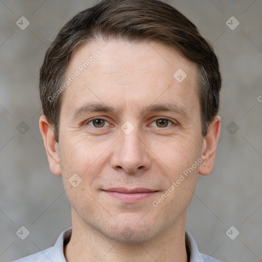 Joyful white adult male with short  brown hair and brown eyes