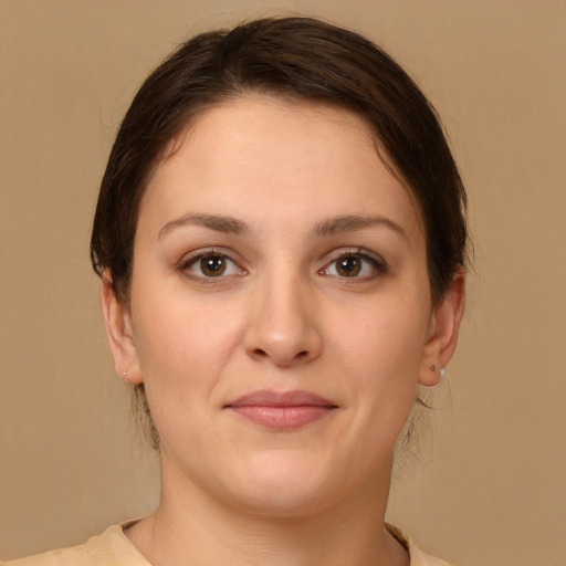 Joyful white young-adult female with medium  brown hair and brown eyes