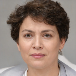 Joyful white adult female with short  brown hair and brown eyes