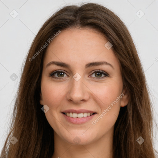 Joyful white young-adult female with long  brown hair and green eyes