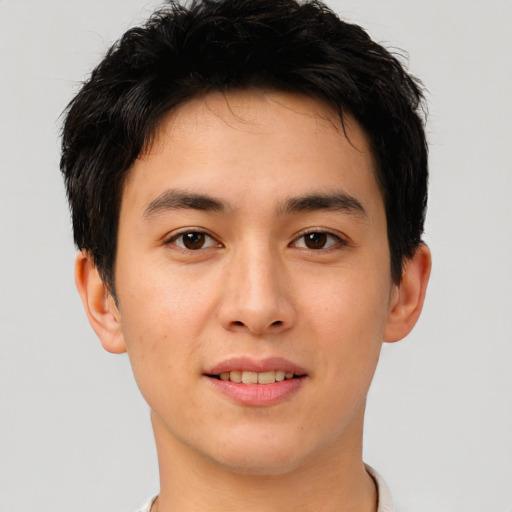 Joyful asian young-adult male with short  black hair and brown eyes