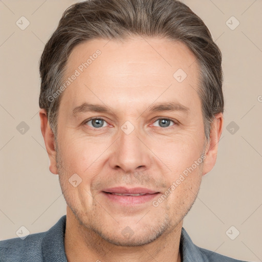 Joyful white adult male with short  brown hair and grey eyes