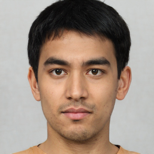 Neutral white young-adult male with short  black hair and brown eyes