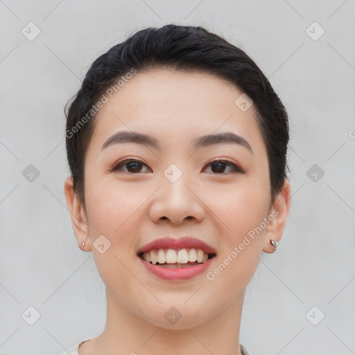 Joyful asian young-adult female with short  black hair and brown eyes