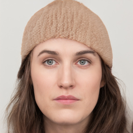 Neutral white young-adult female with long  brown hair and grey eyes