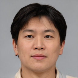 Neutral asian young-adult male with short  brown hair and brown eyes