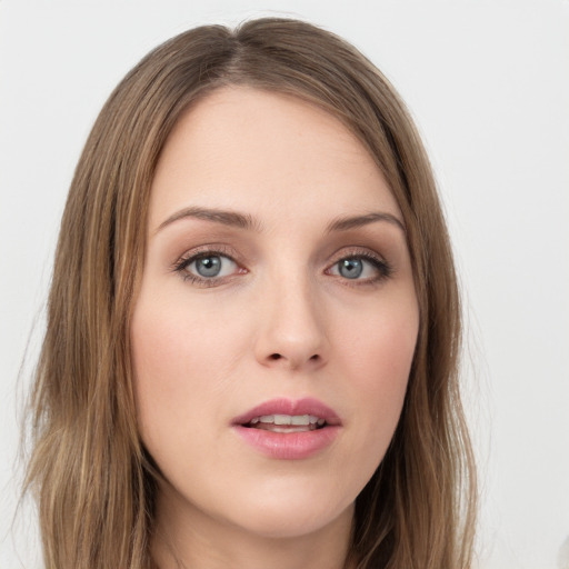 Neutral white young-adult female with long  brown hair and green eyes