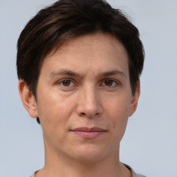 Joyful white adult female with short  brown hair and brown eyes