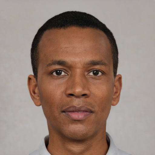 Neutral black young-adult male with short  black hair and brown eyes