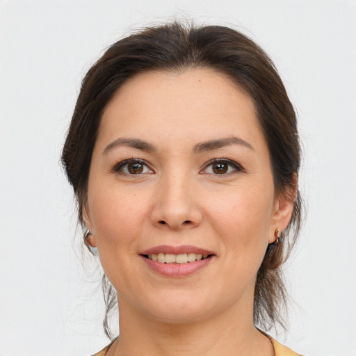 Joyful white young-adult female with medium  brown hair and brown eyes