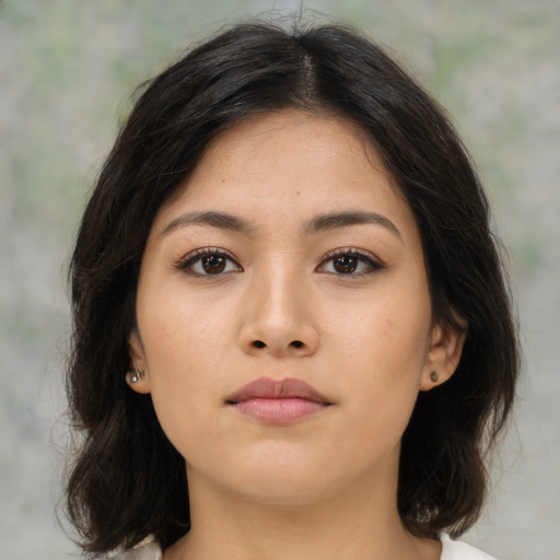 Neutral asian young-adult female with medium  brown hair and brown eyes