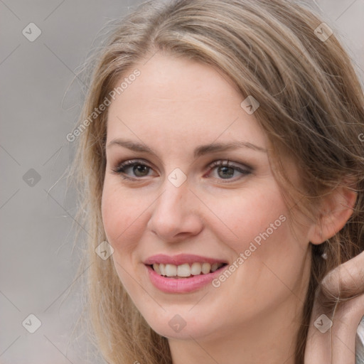 Joyful white young-adult female with long  brown hair and grey eyes