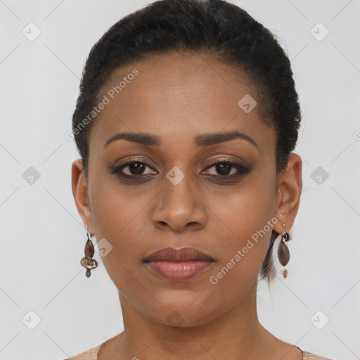 Joyful black young-adult female with short  brown hair and brown eyes