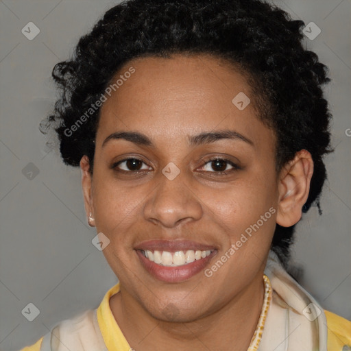 Joyful black young-adult female with short  brown hair and brown eyes