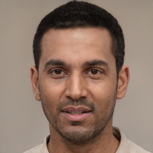 Neutral black adult male with short  black hair and brown eyes