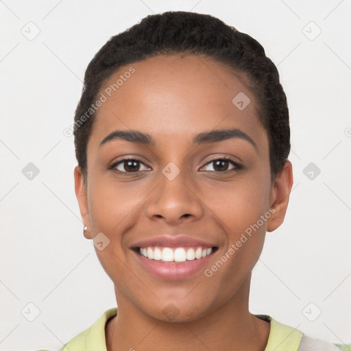 Joyful latino young-adult female with short  black hair and brown eyes