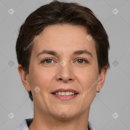 Joyful white adult female with short  brown hair and brown eyes