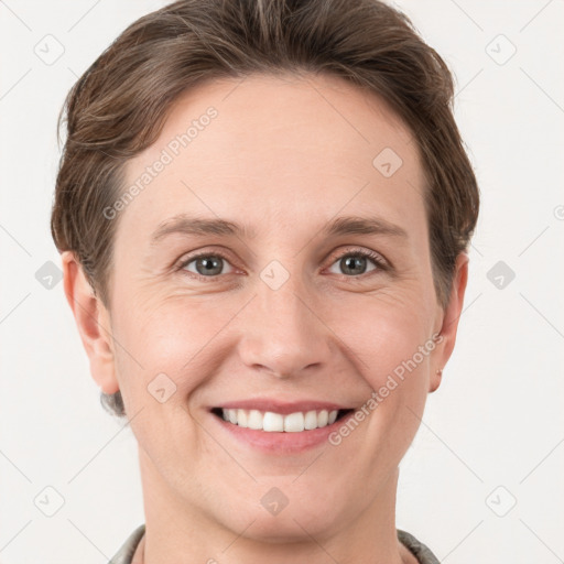 Joyful white young-adult female with short  brown hair and grey eyes