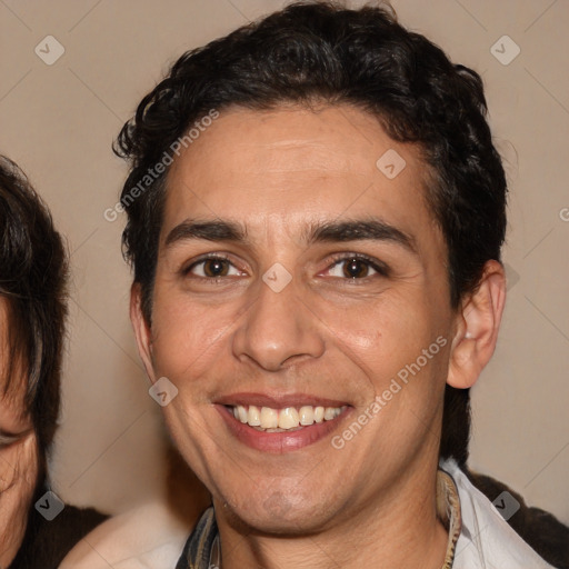 Joyful white adult male with medium  brown hair and brown eyes