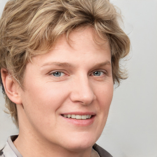 Joyful white young-adult female with medium  brown hair and blue eyes