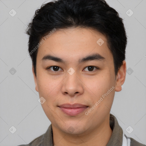 Joyful asian young-adult male with short  brown hair and brown eyes