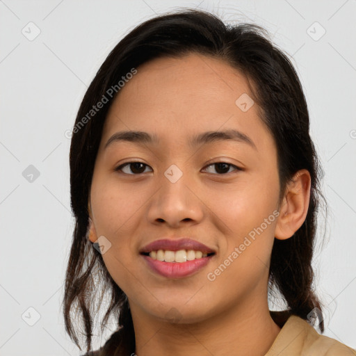 Joyful asian young-adult female with long  brown hair and brown eyes