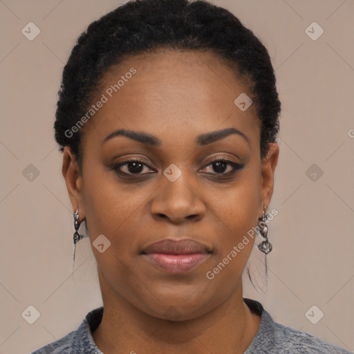 Joyful black young-adult female with short  black hair and brown eyes