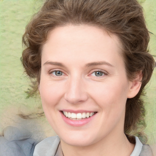 Joyful white young-adult female with medium  brown hair and green eyes