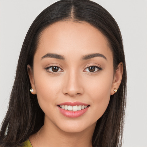 Joyful white young-adult female with long  brown hair and brown eyes