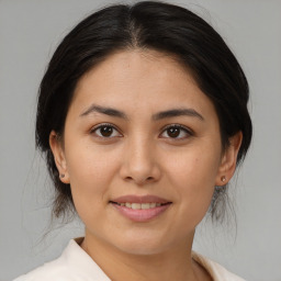 Joyful asian young-adult female with medium  brown hair and brown eyes