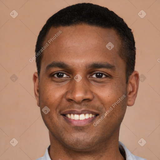 Joyful latino young-adult male with short  black hair and brown eyes