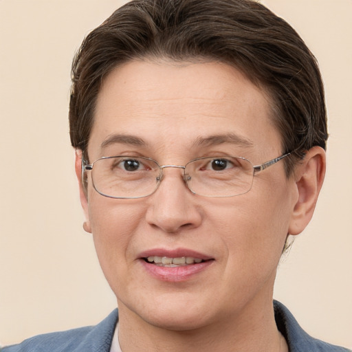 Joyful white adult female with short  brown hair and grey eyes