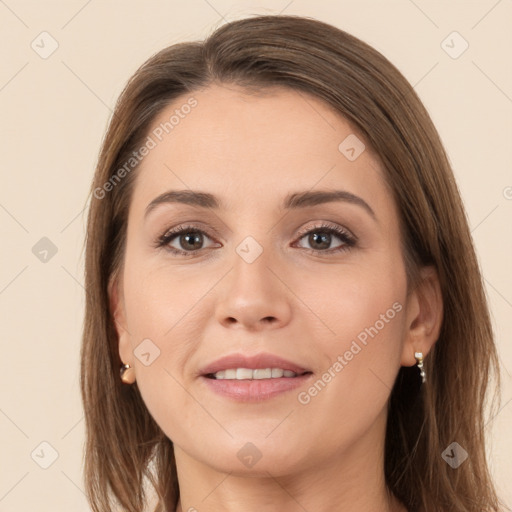 Joyful white young-adult female with long  brown hair and grey eyes