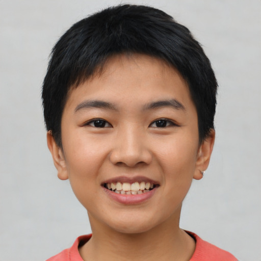 Joyful asian young-adult female with short  black hair and brown eyes
