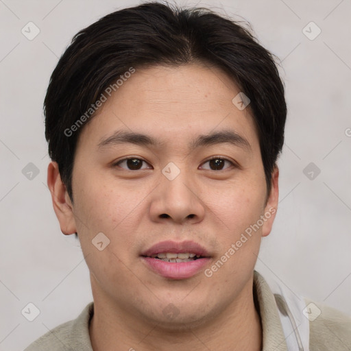 Joyful asian young-adult male with short  brown hair and brown eyes