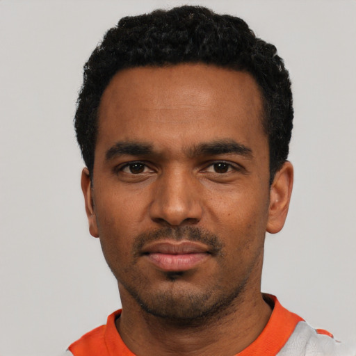 Neutral black young-adult male with short  black hair and brown eyes