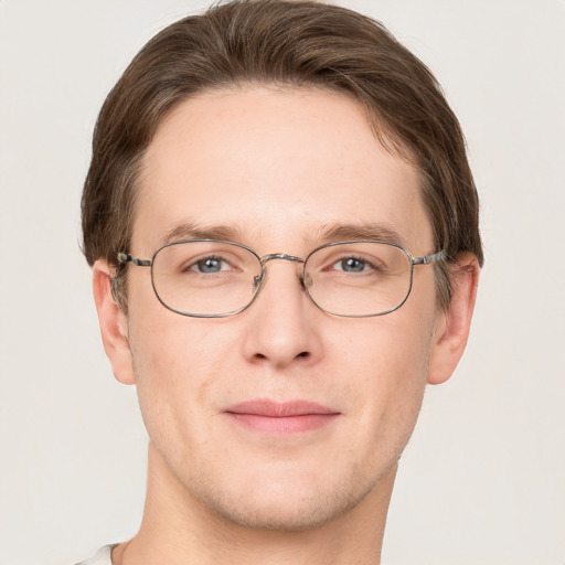 Joyful white adult male with short  brown hair and grey eyes