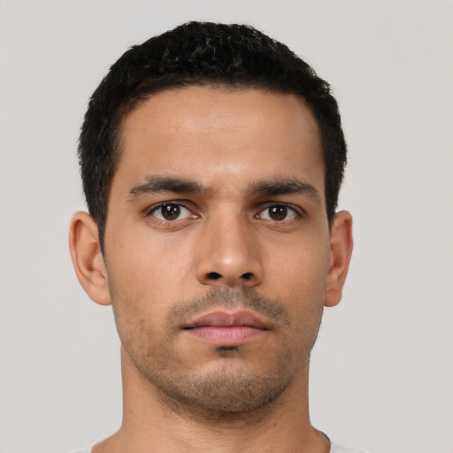 Neutral latino young-adult male with short  brown hair and brown eyes