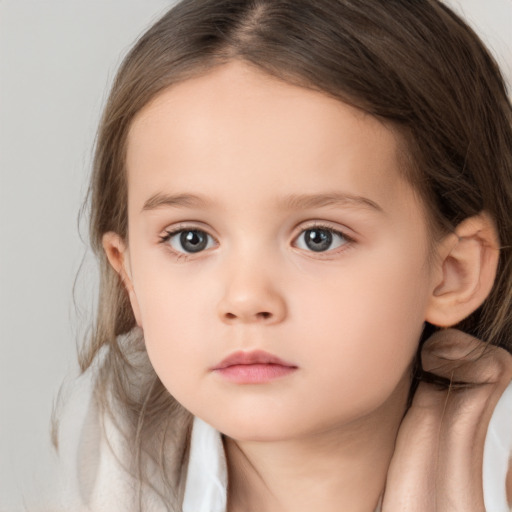 Neutral white child female with medium  brown hair and brown eyes